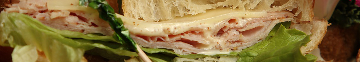 Eating Sandwich at Grove Grinder restaurant in Lemon Grove, CA.